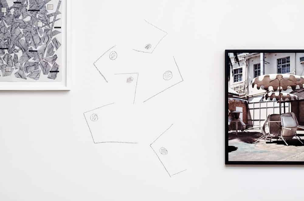 Installation view at A4 offices with Nolan Oswald Dennis, ‘Dark Places II’, 2016. Pen on paper (detail left), courtesy of the artist and Goodman Gallery, Thabiso Sekgala, ‘The Terrace Hotel, Bulawayo’, 2013, Inkjet print (detail right). Photograph by Andrew Juries.